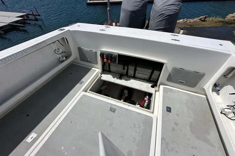 Slide: The Image of Open deck of 2012 Davis Rock Harbor 25 boat with storage compartments. - 19