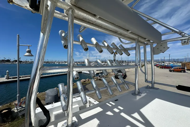 Slide: The Image of Boat docked at marina with rod holders, Davis Rock Harbor 25, 2012 model. - 30