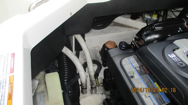 Slide: The Image of Engine compartment of a 2020 Sea Ray SLX 250 boat, showing detailed components. - 17