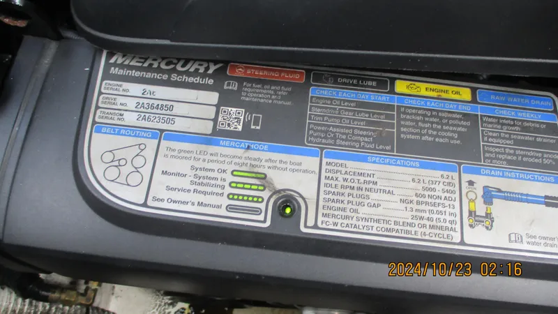 Slide: The Image of Mercury engine maintenance schedule label on a 2020 Sea Ray SLX 250 boat. - 18