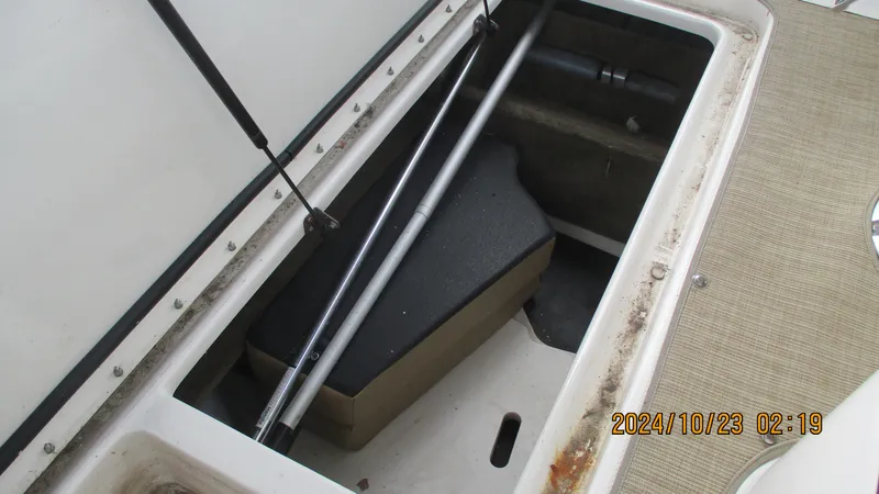 Slide: The Image of Open storage compartment in 2020 Sea Ray SLX 250 boat. - 22