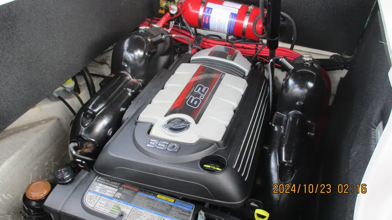 Slide: The Image of Engine compartment of 2020 Sea Ray SLX 250 with 6.2L engine and fire extinguisher. - 27