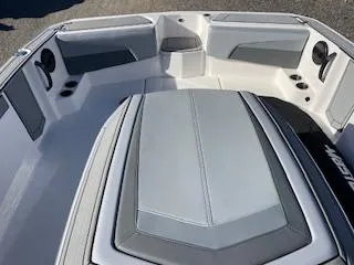 Slide: The Image of 2024 MasterCraft ProStar boat interior with gray seating and sleek design. - 6