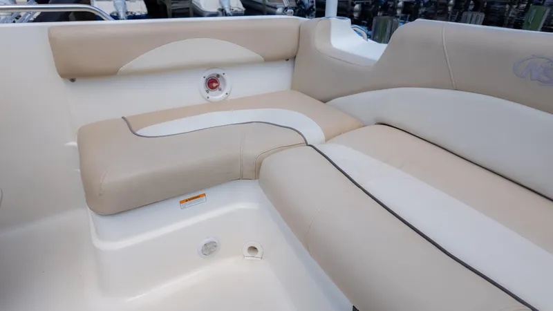 Slide: The Image of 2017 NauticStar 203 SC boat interior with beige seating. - 21
