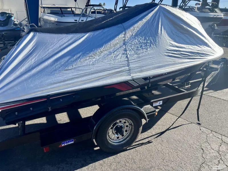 Slide: The Image of 2018 Yamaha WaveRunner VX Cruiser/Limited covered on trailer in a marina. - 8