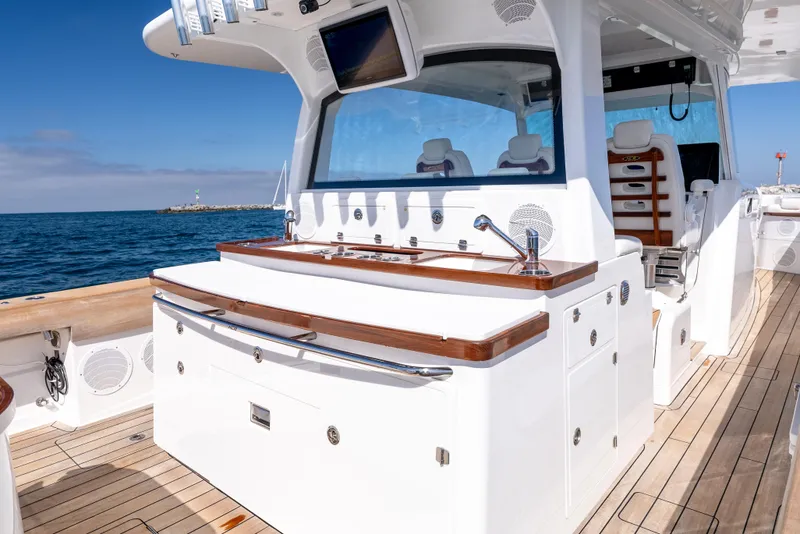 Slide: The Image of 2020 HCB 53 Sueños yacht deck with luxurious seating and ocean view. - 11