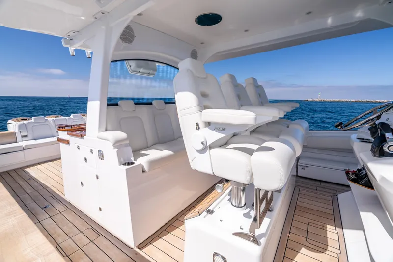 Slide: The Image of Luxurious 2020 HCB 53 Sueños yacht interior with white seating and ocean view. - 14