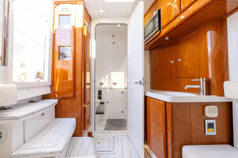 Slide: The Image of Luxurious interior of 2020 HCB 53 Sueños yacht with wooden cabinetry and modern amenities. - 19