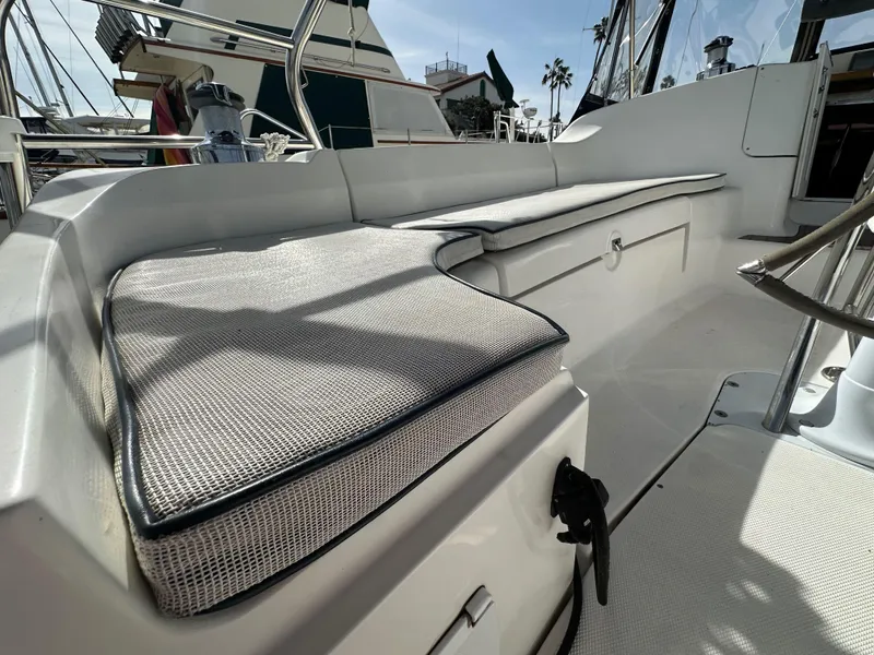 Slide: The Image of 2008 Hunter 38 sailboat cockpit with cushioned seating and steering wheel. - 27