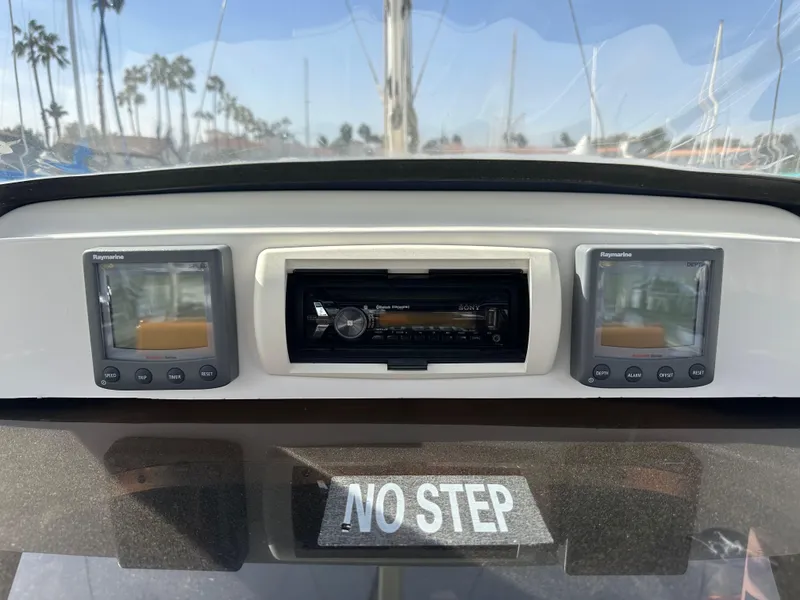 Slide: The Image of Boat dashboard with navigation instruments, "No Step" sign, Hunter 38, 2008 model. - 41