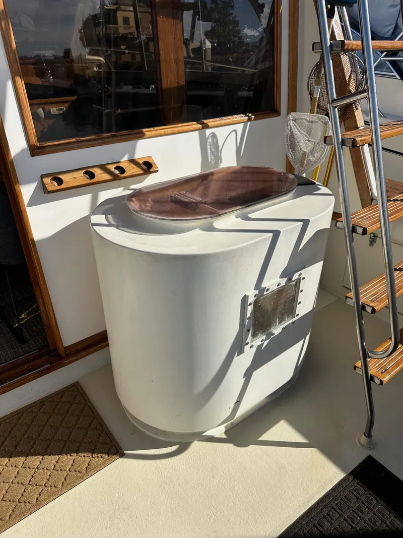 Slide: The Image of 1985 Egg Harbor 33 Sedan boat deck with sink and wooden ladder. - 18