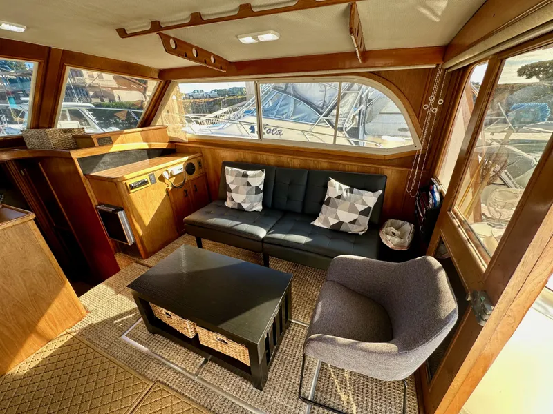 Slide: The Image of Interior of 1985 Egg Harbor 33 Sedan with cozy seating and nautical decor. - 22