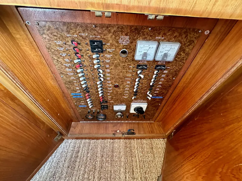 Slide: The Image of Electrical panel of 1985 Egg Harbor 33 Sedan boat with switches and gauges. - 27