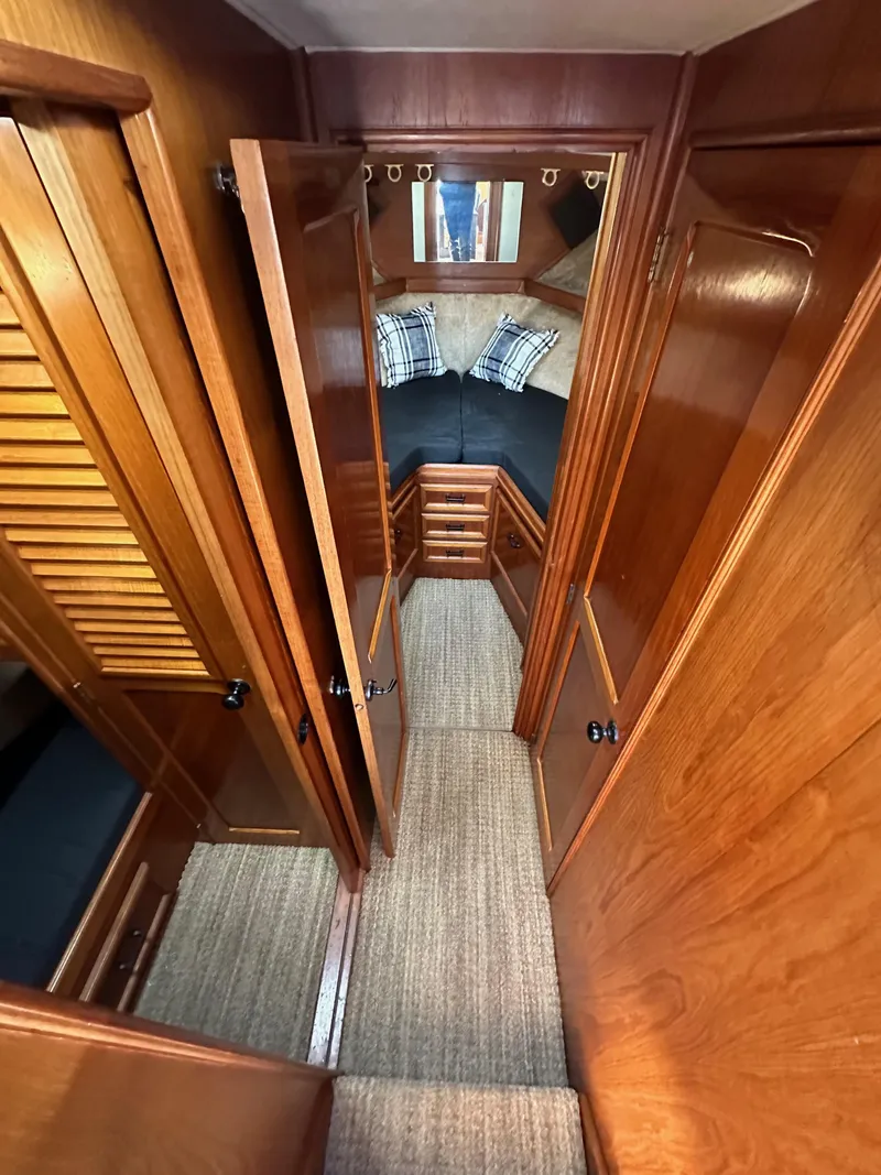 Slide: The Image of Interior of 1985 Egg Harbor 33 Sedan with wood paneling and cozy cabin space. - 32