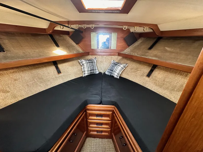 Slide: The Image of Interior cabin of 1985 Egg Harbor 33 Sedan with cozy bedding and wooden accents. - 38