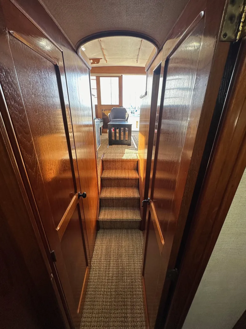 Slide: The Image of Interior view of 1985 Egg Harbor 33 Sedan with wooden paneling and carpeted steps. - 41