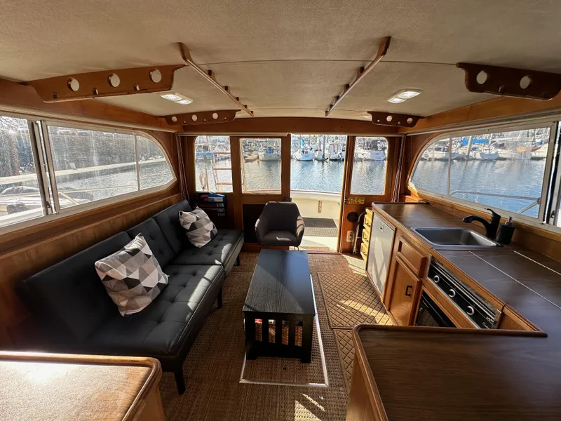 Slide: The Image of Interior of 1985 Egg Harbor 33 Sedan yacht with modern furnishings and marina view. - 44