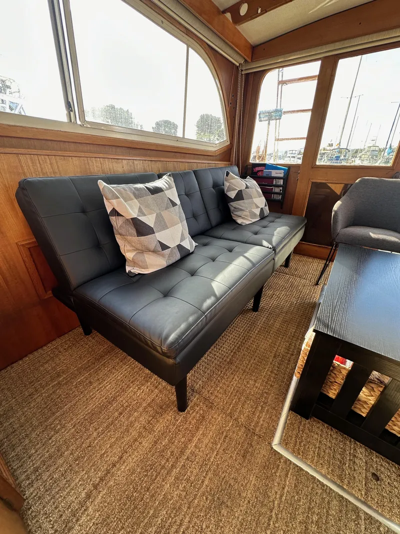 Slide: The Image of Interior of 1985 Egg Harbor 33 Sedan with modern sofa and geometric pillows. - 45