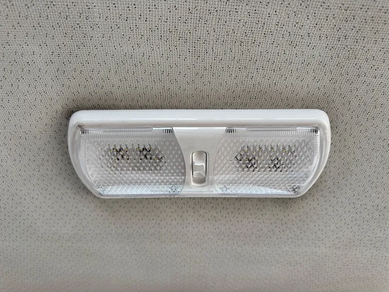 Slide: The Image of Ceiling light fixture in 1985 Egg Harbor 33 Sedan boat interior. - 48