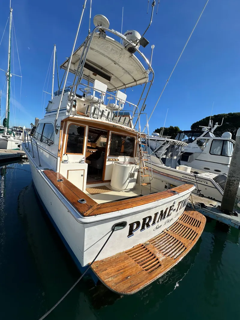 Slide: The Image of 1985 Egg Harbor 33 Sedan boat docked in marina, rear view. - 8