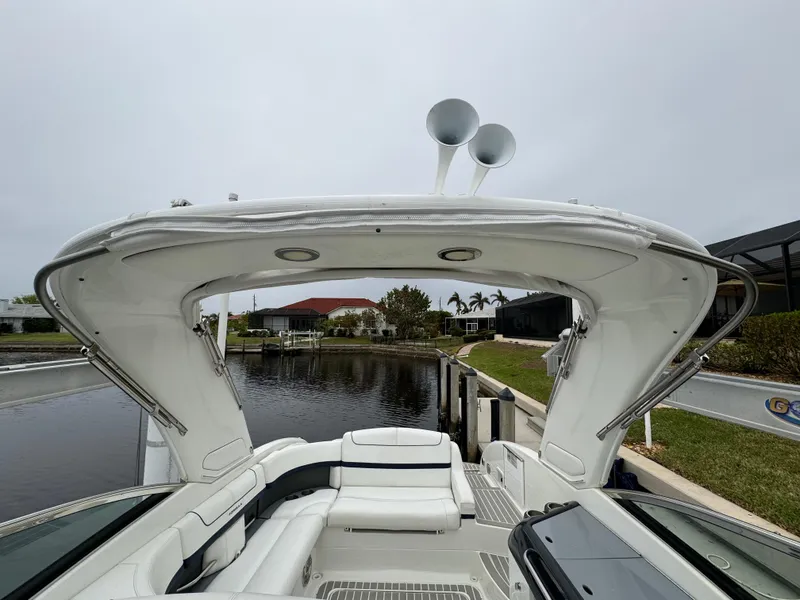 Slide: The Image of 2018 Formula 310SS boat with spacious seating and sleek design by a calm waterfront. - 15