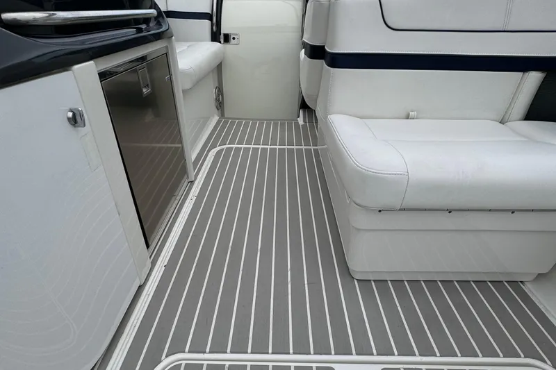 Slide: The Image of 2018 Formula 310SS boat interior with sleek seating and modern flooring. - 16