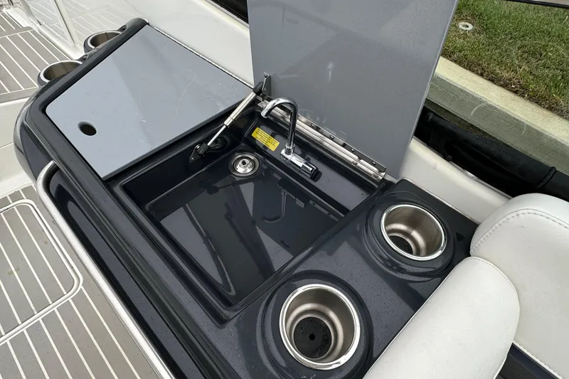 Slide: The Image of 2018 Formula 310SS boat sink and cup holders on deck. - 18