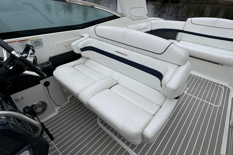 Slide: The Image of 2018 Formula 310SS boat interior with white leather seating and sleek design. - 20