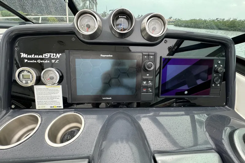Slide: The Image of Dashboard of a 2018 Formula 310SS boat with navigation screens and gauges. - 22