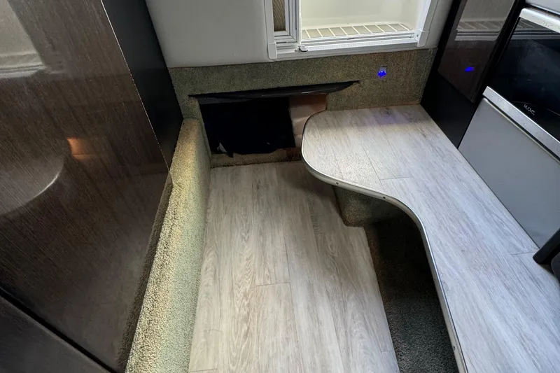 Slide: The Image of Interior of 2018 Formula 310SS boat with modern wood flooring and sleek design. - 27