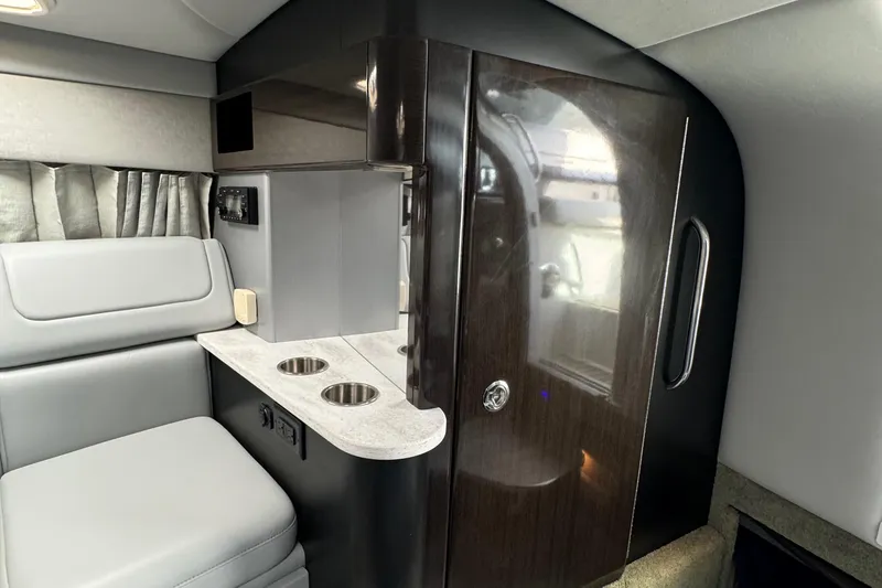 Slide: The Image of 2018 Formula 310SS cabin interior with seating, kitchenette, and storage. - 28