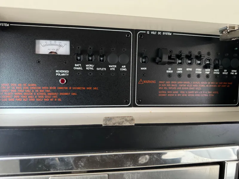 Slide: The Image of Control panel of a 2018 Formula 310SS boat with various switches and warnings. - 35