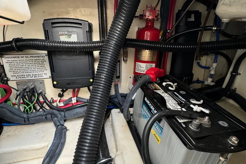 Slide: The Image of Engine compartment of 2018 Formula 310SS with battery, wiring, and fire extinguisher. - 39