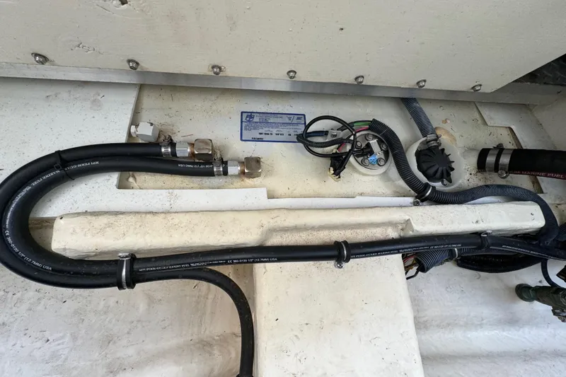 Slide: The Image of Engine compartment of 2018 Formula 310SS with visible hoses and wiring. - 42