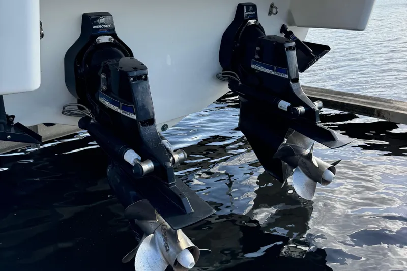 Slide: The Image of 2018 Formula 310SS boat propellers in water, showcasing dual outboard motors. - 6
