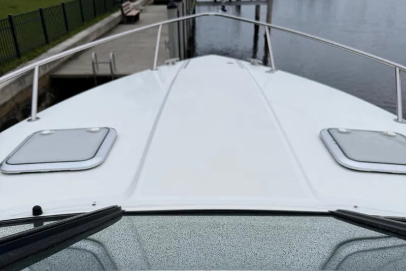 Slide: The Image of 2018 Formula 310SS boat bow view at dockside. - 8