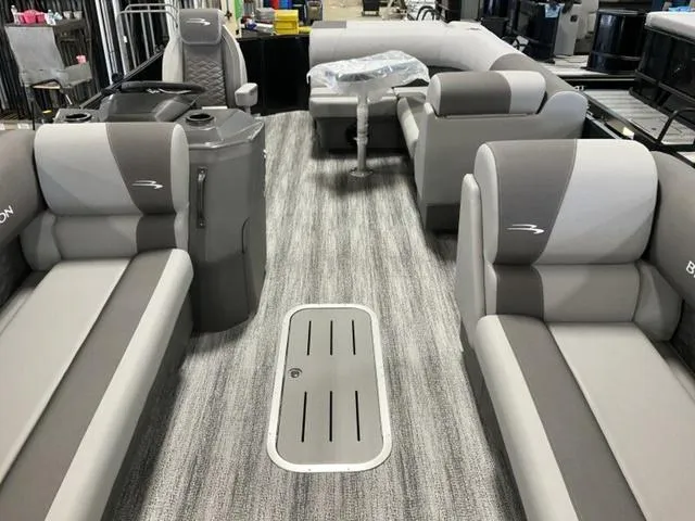 Slide: The Image of 2025 Bennington 23 SL pontoon boat interior with gray seating and flooring. - 3