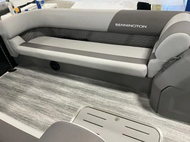 Slide: The Image of 2025 Bennington 23 SL boat interior with gray seating and flooring. - 5