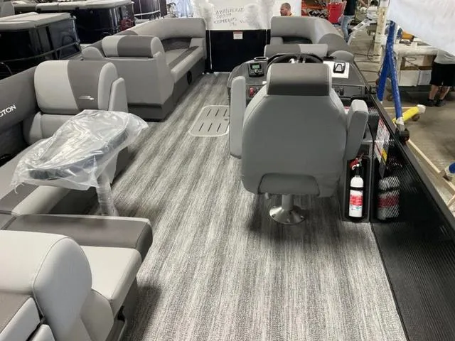 Slide: The Image of 2025 Bennington 23 SL pontoon boat interior with gray seating and modern design. - 6