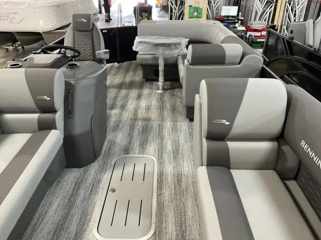 Slide: The Image of 2025 Bennington 23 SL pontoon boat interior with gray seating and modern design. - 3
