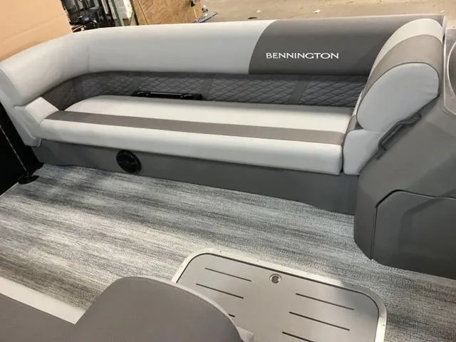Slide: The Image of 2025 Bennington 23 SL boat interior with gray seating and flooring. - 5