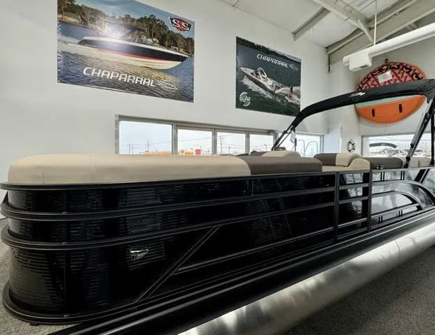 Slide: The Image of 2025 Bennington 23 SL pontoon boat interior with plush seating and modern helm. - 1
