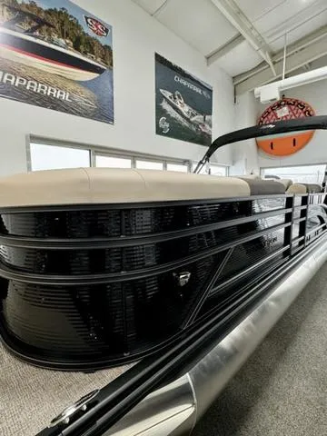 Slide: The Image of 2025 Bennington 23 SL pontoon boat interior with beige and brown seating. - 13