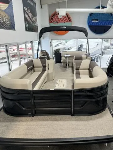 Slide: The Image of 2025 Bennington 23 SL pontoon boat interior with plush seating and modern helm. - 2