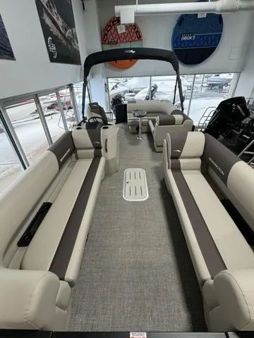 Slide: The Image of 2025 Bennington 23 SL pontoon boat in showroom, sleek black design. - 4