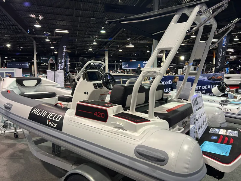 Slide: The Image of Highfield Velox 420 boat cruising on water at sunset, 2025 model. - 10