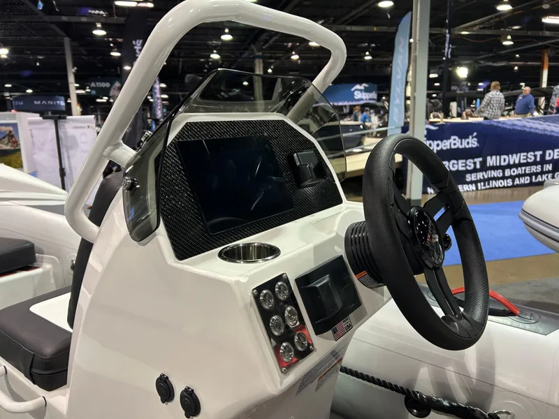 Slide: The Image of 2025 Highfield Velox 420 inflatable boat displayed at an indoor exhibition. - 12