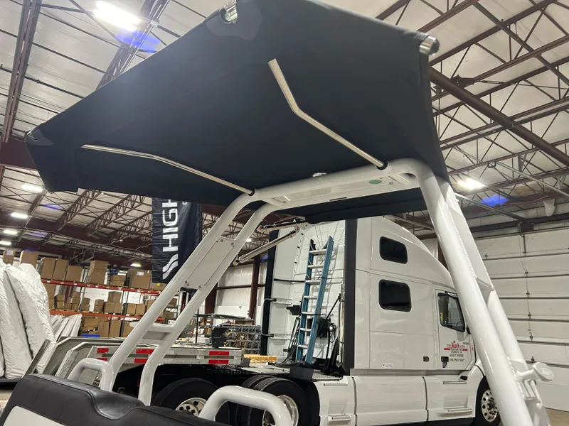 Slide: The Image of 2025 Highfield Velox 420 boat canopy in a warehouse setting. - 8