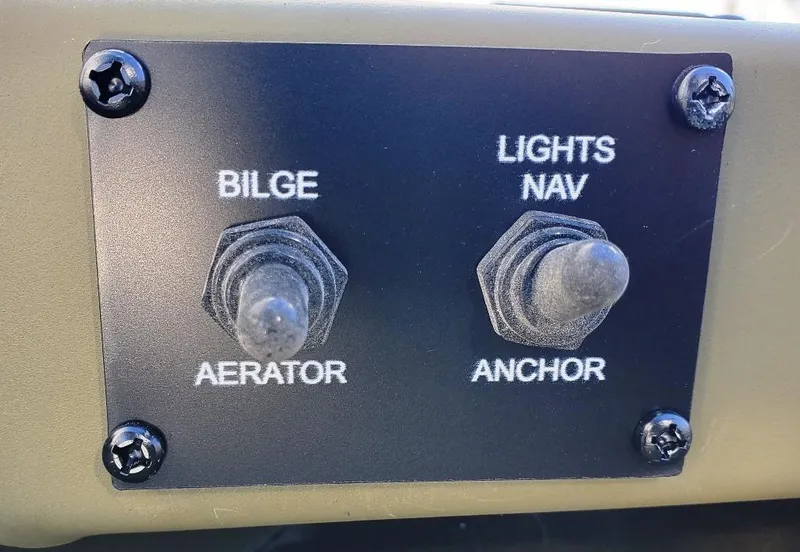 Slide: The Image of Control panel with switches for bilge pump, livewell aerator and navigation lights. - 6
