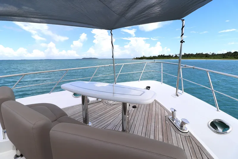 Slide: The Image of Luxury deck of 2013 Cheoy Lee Bravo yacht with ocean view and seating area. - 10